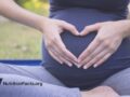 pregnant woman with hands on belly