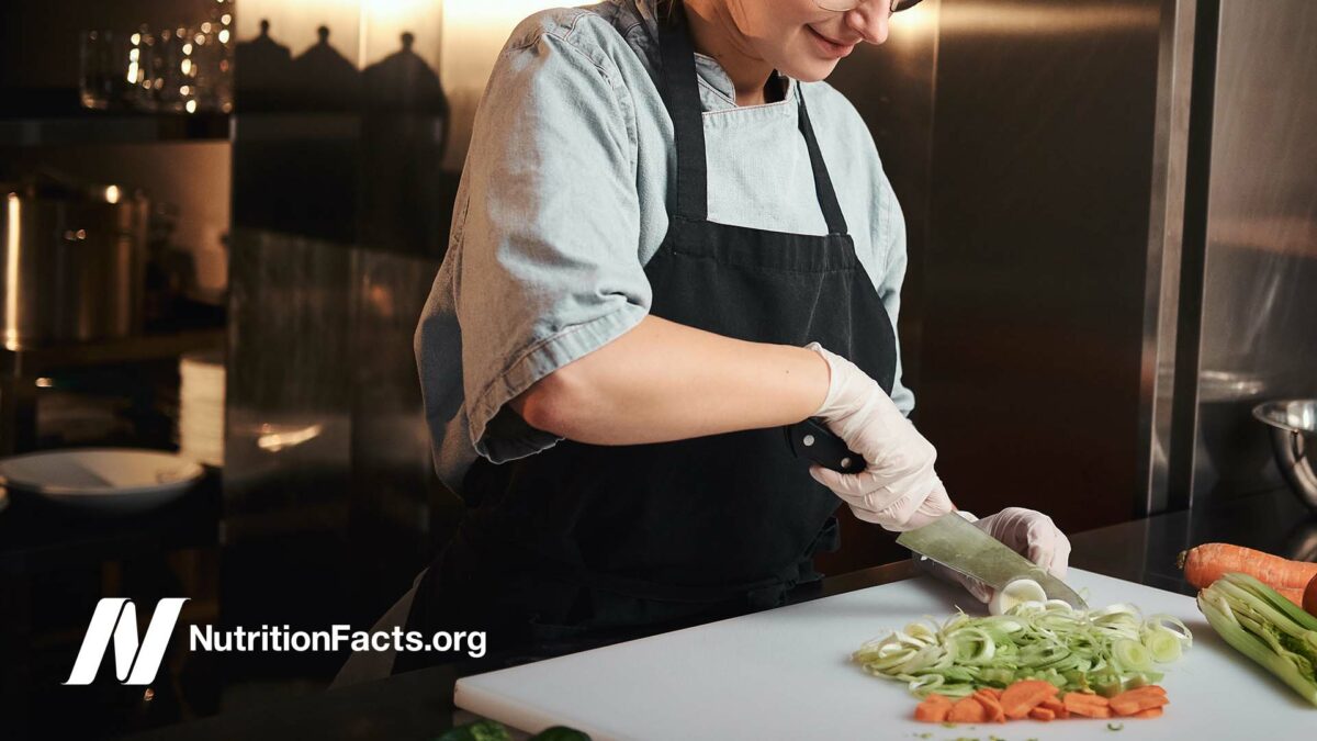 person chopping vegetables