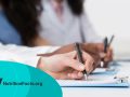 Medical Students Writing On Paper At Conference