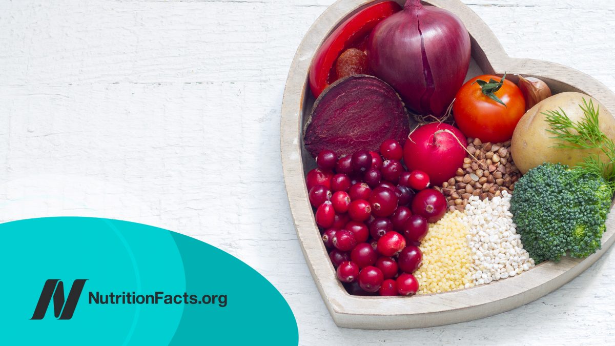 Healthy fruits and vegetables in heart shaped bowl
