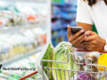Woman with shopping cart with vegetables