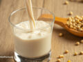 Soy beans alongside milk in a glass