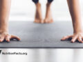 Rolling up a yoga mat in a classroom setting
