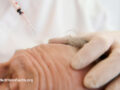 Injector working on a man’s forehead