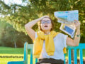 Woman experiencing hot flash on a bench outside