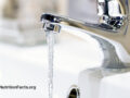 chrome faucet with water running